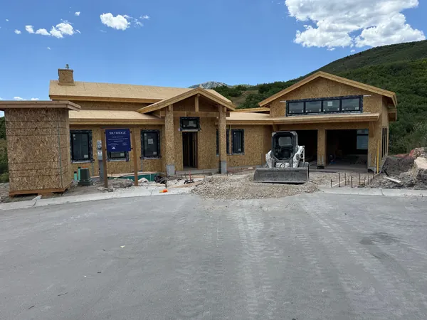Crackstone under construction, framed with roof sheathing and rough openings