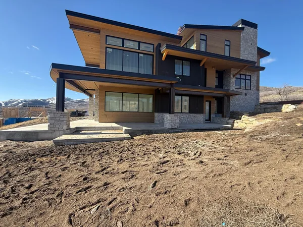 Lot 223 under construction, exterior siding and stone masonry going in
