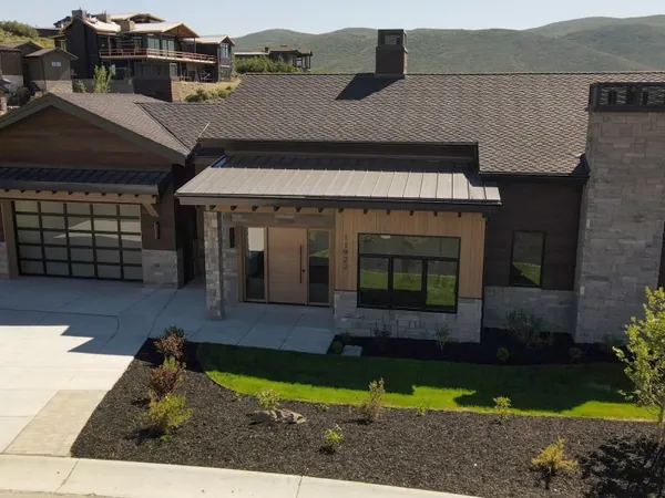 Cooper, a Mayflower home in SkyRidge with a covered entry and glass garage doors