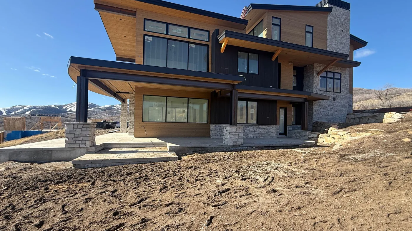 A Mayflower home under construction, framed and dried-in with mountain views